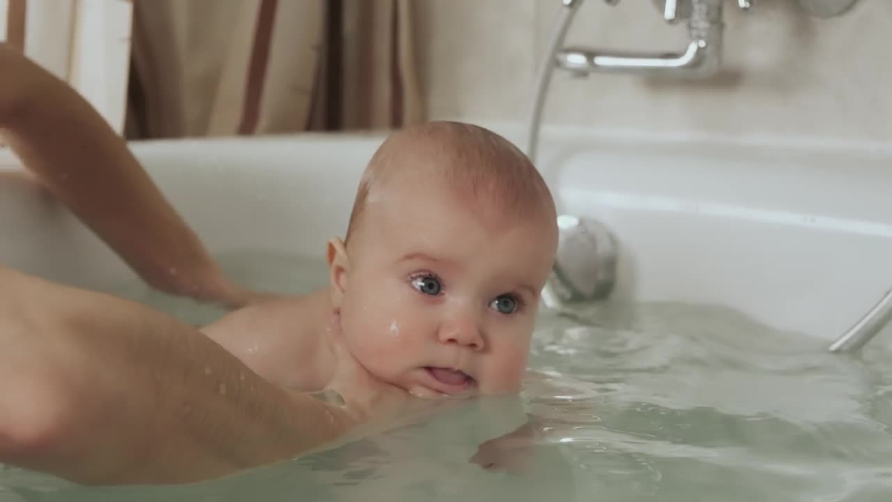 Stock Video Mother Bathing Her Baby In The Tu Animated Wallpaper - Free Download