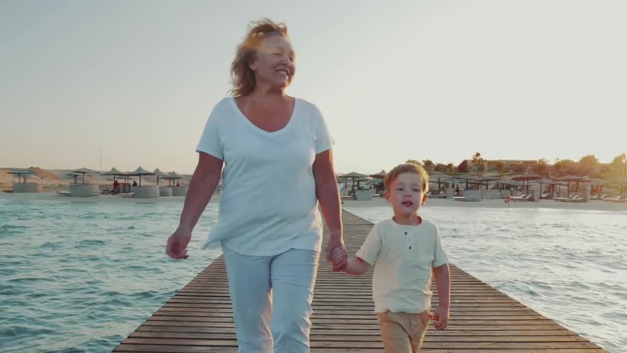 Stock Video Grandmother Walking Along A Pier Live Wallpaper For PC - Free Download