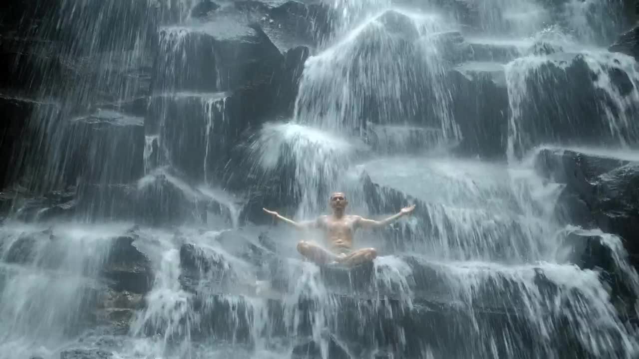 Stock Video Man Practicing Mind Body Meditation In Waterfal Animated Wallpaper - Free Download