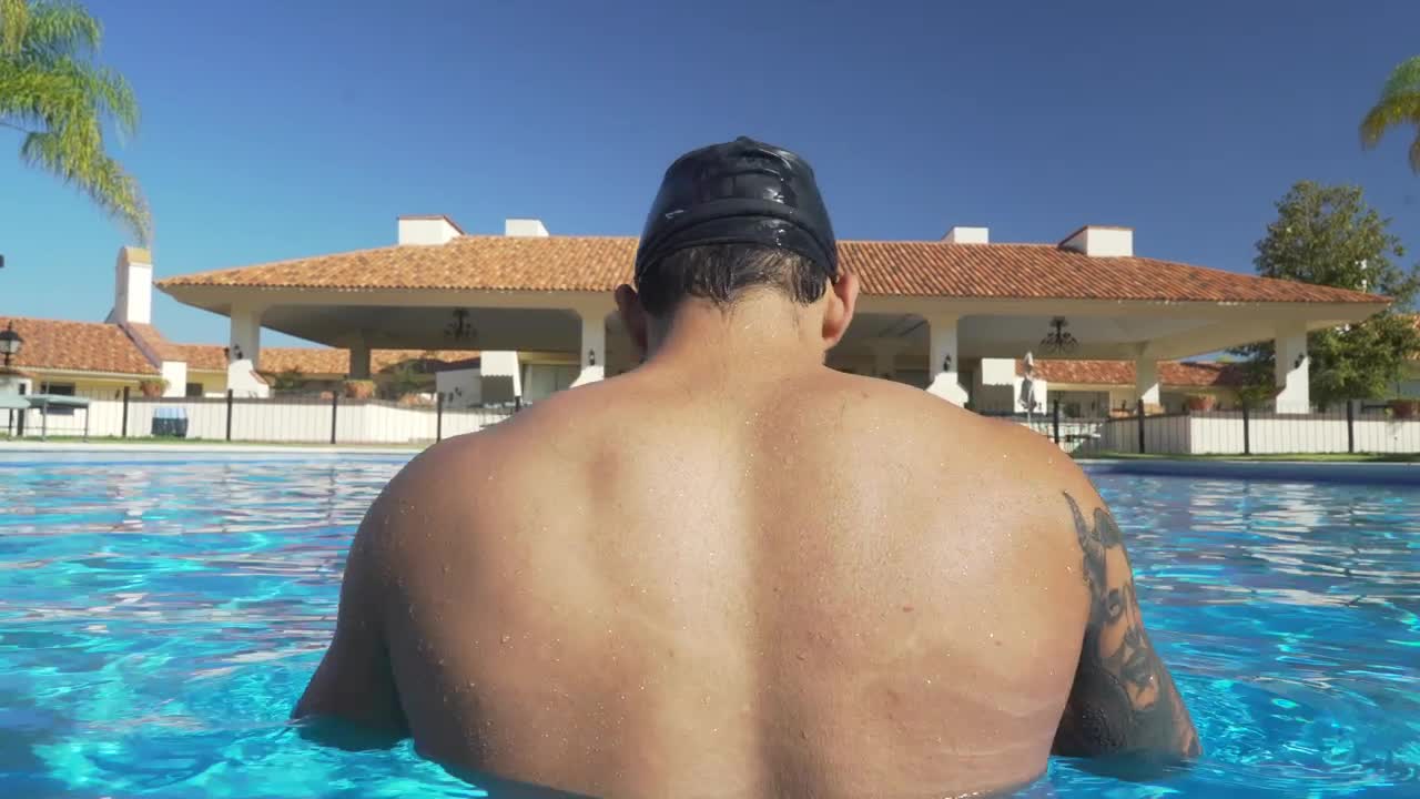 Free Video Stock swimmer in the pool seen from behind Live Wallpaper - Free Download