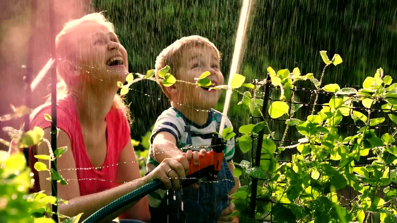 Stock Video Mother And Child Spraying A Hos Animated Wallpaper - Free Download