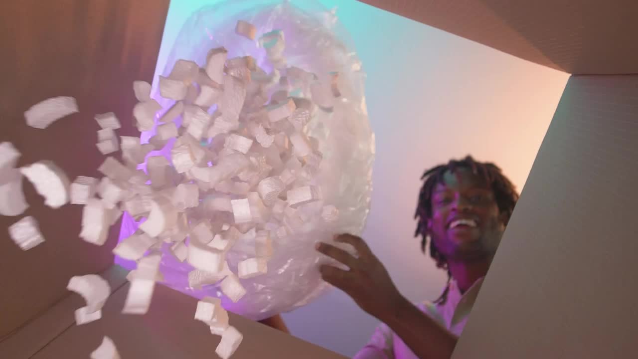 Free Stock Video Young Man Filling A Stuffing Box For Packing Live Wallpaper - Free Download