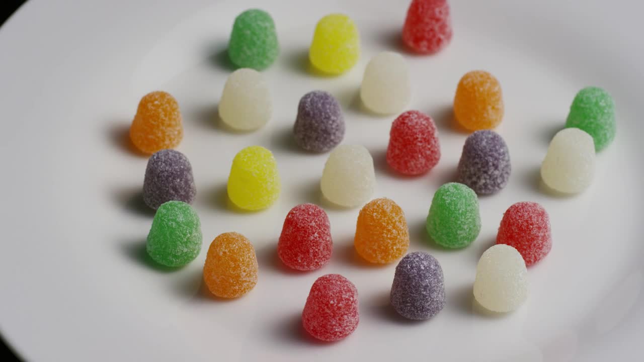 Stock Video Multicolor Gummys Rotating On A Plate Live Wallpaper - Free Download