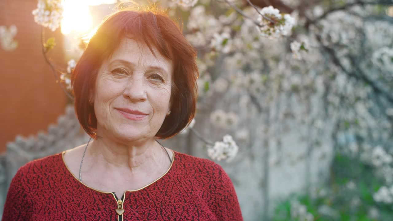 Free Stock Video Woman Smiling At Camera In Front Of A Flowering Tree Live Wallpaper - Free Download