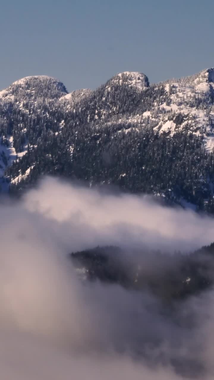 Stock Video Mist At The Base Of A Snowy Mountai Animated Wallpaper - Free Download