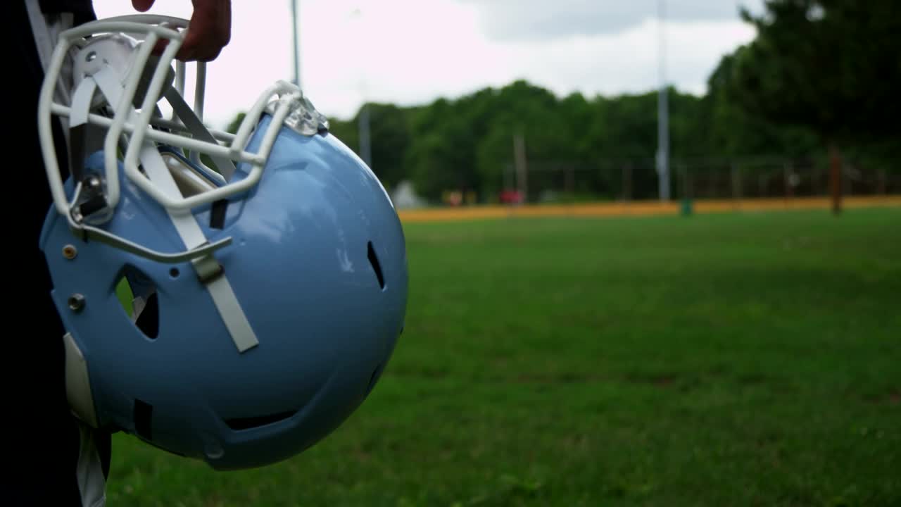 Stock Video Holding A Football Helmet At A Court Animated Wallpaper - Free Download