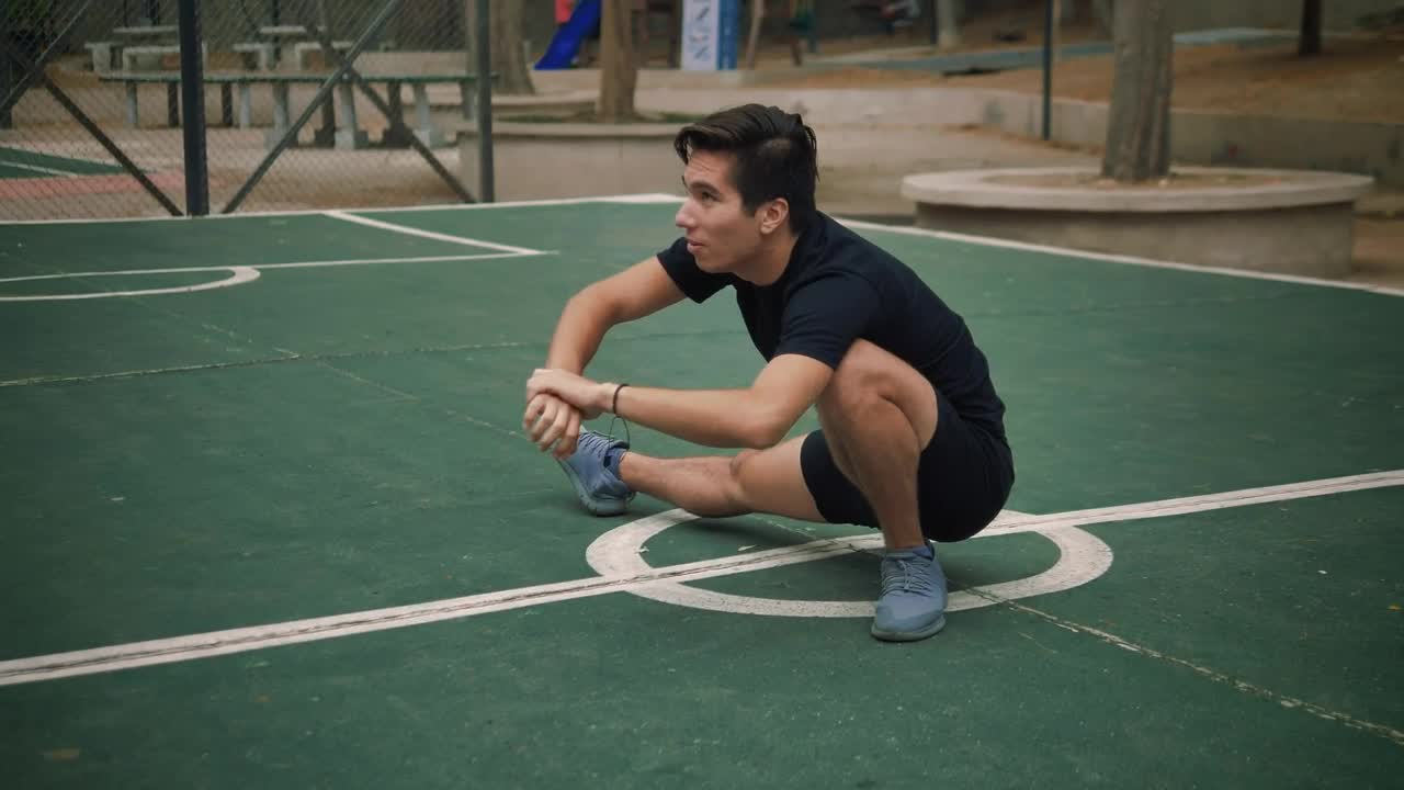 Free Stock Video Young Man Stretching On The Court In A Park Live Wallpaper - Free Download