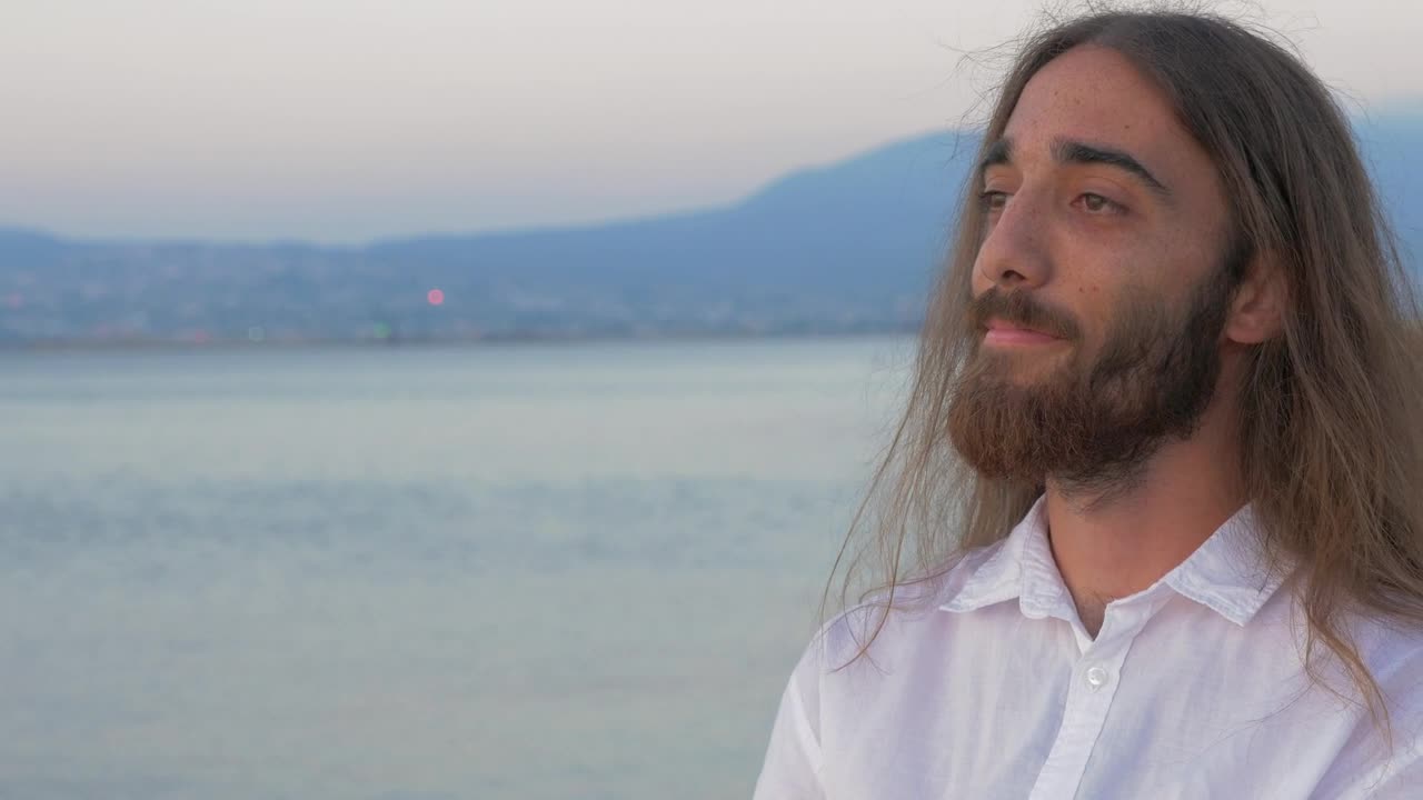 Stock Video Man With Long Hair And A Beard Looking Awa Animated Wallpaper - Free Download
