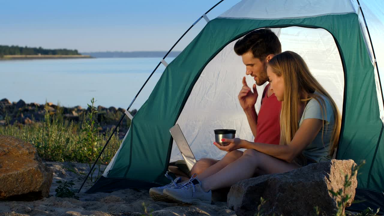 Stock Video Couple Relaxing While Camping At The Lake Live Wallpaper For PC - Free Download