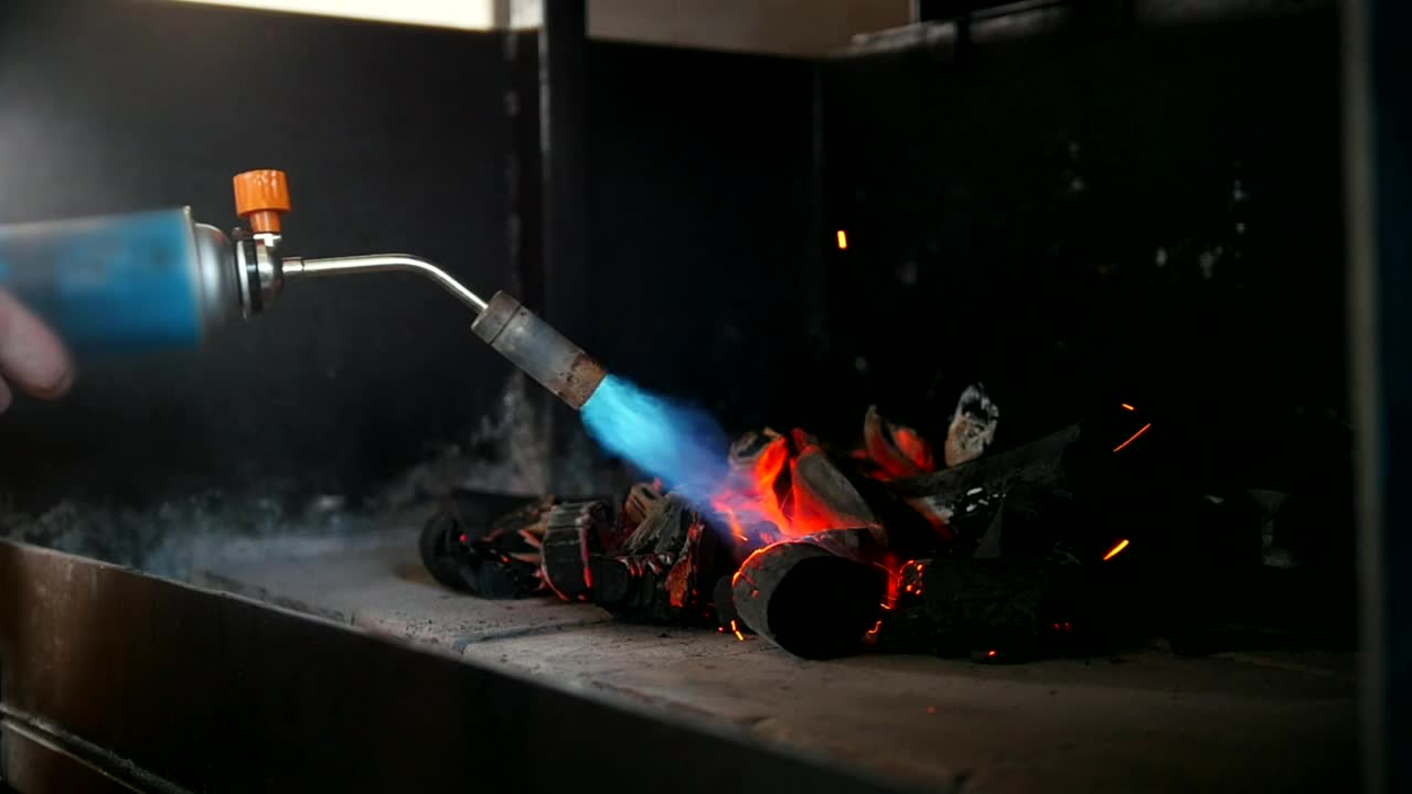 Stock Video Kindling Charcoal Using A Gas Burner Animated Wallpaper - Free Download