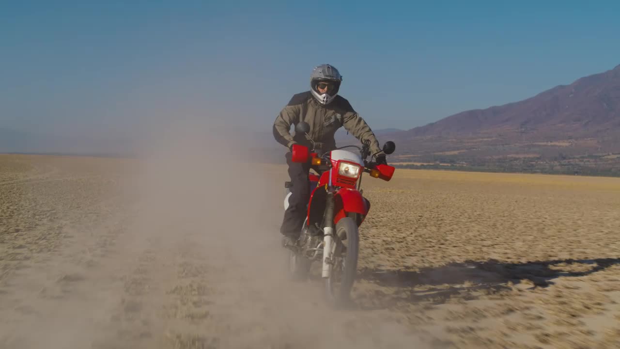 Stock Video Motorcyclist On A Red Motorcycle In The Desert Live Wallpaper - Free Download