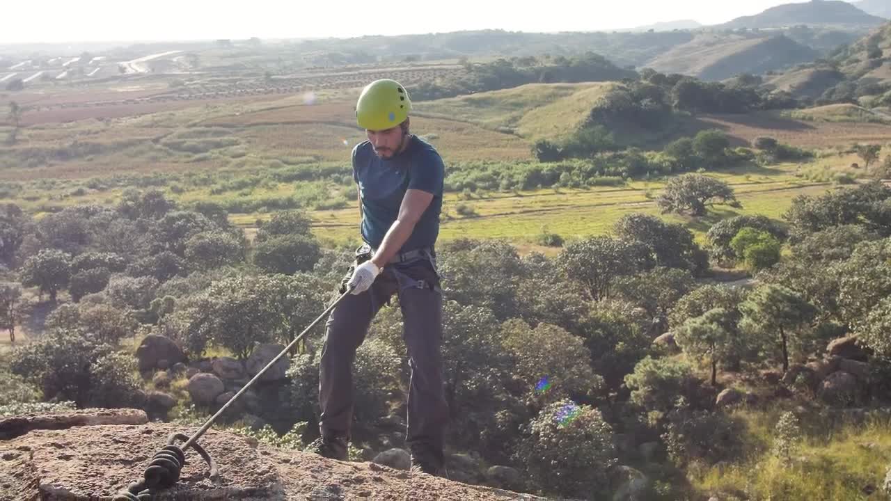 Stock Video Man Slowly Coming Down From The Top Of A Hil Animated Wallpaper - Free Download