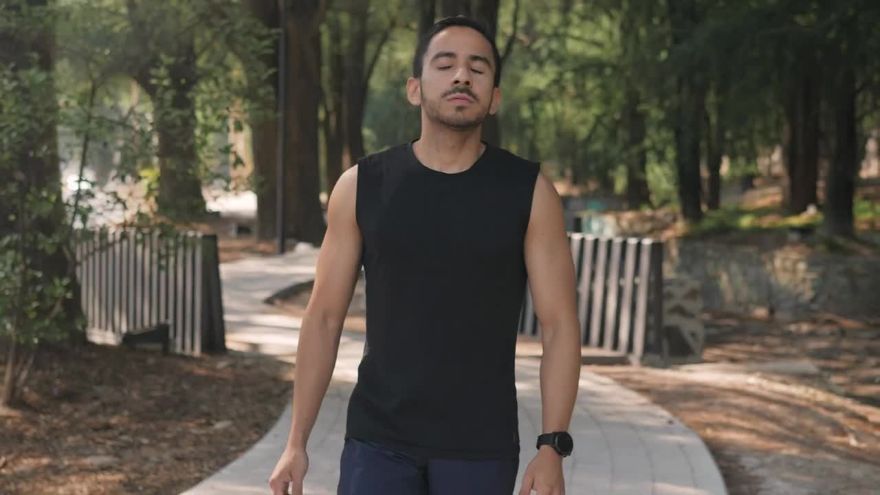 Stock Video Man Warming Up In A Park Before Exercisin Animated Wallpaper - Free Download
