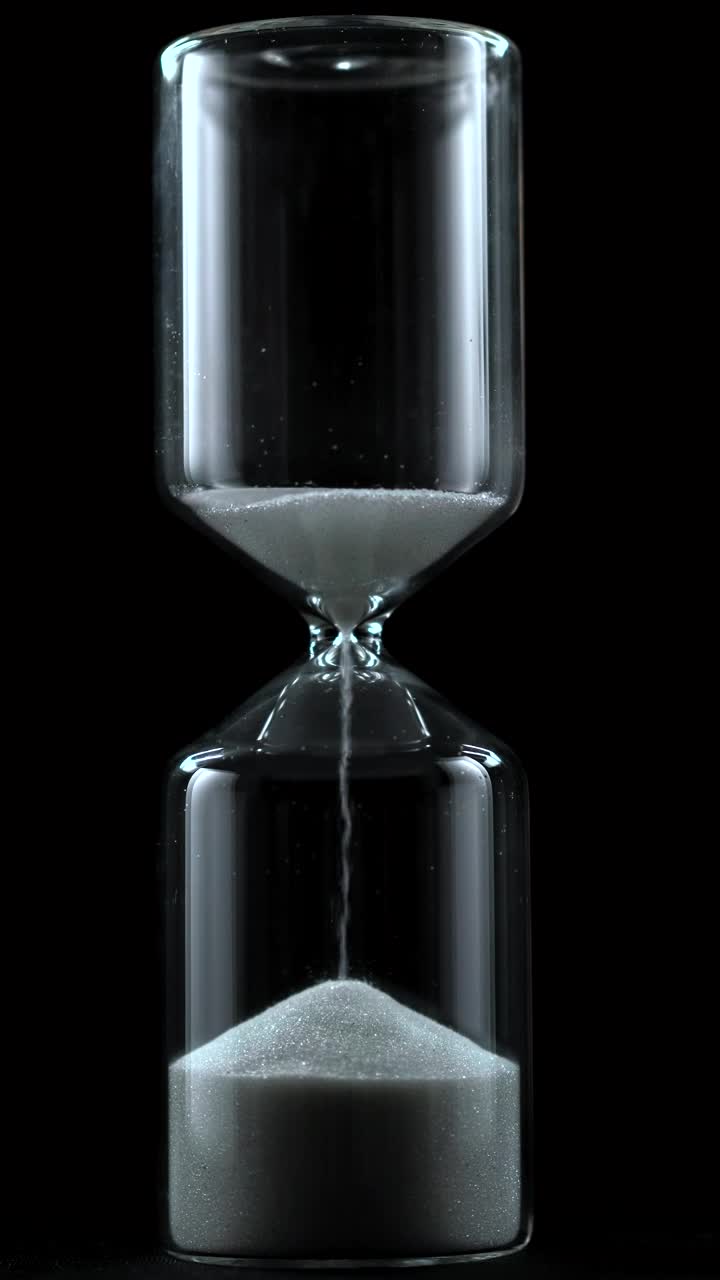 Free Stock Video Sand Falling From An Hourglass On A Black Background Live Wallpaper - Free Download