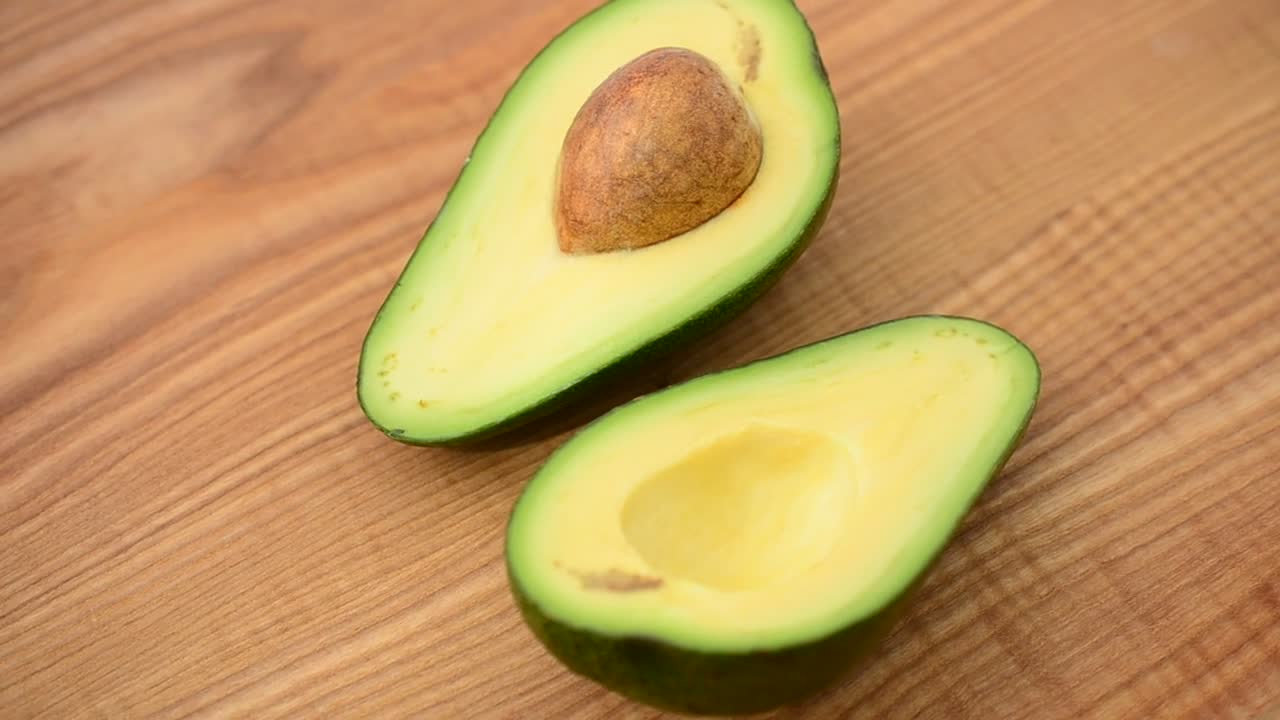 Stock Video Halved Avocado On A Table Live Wallpaper For PC - Free Download