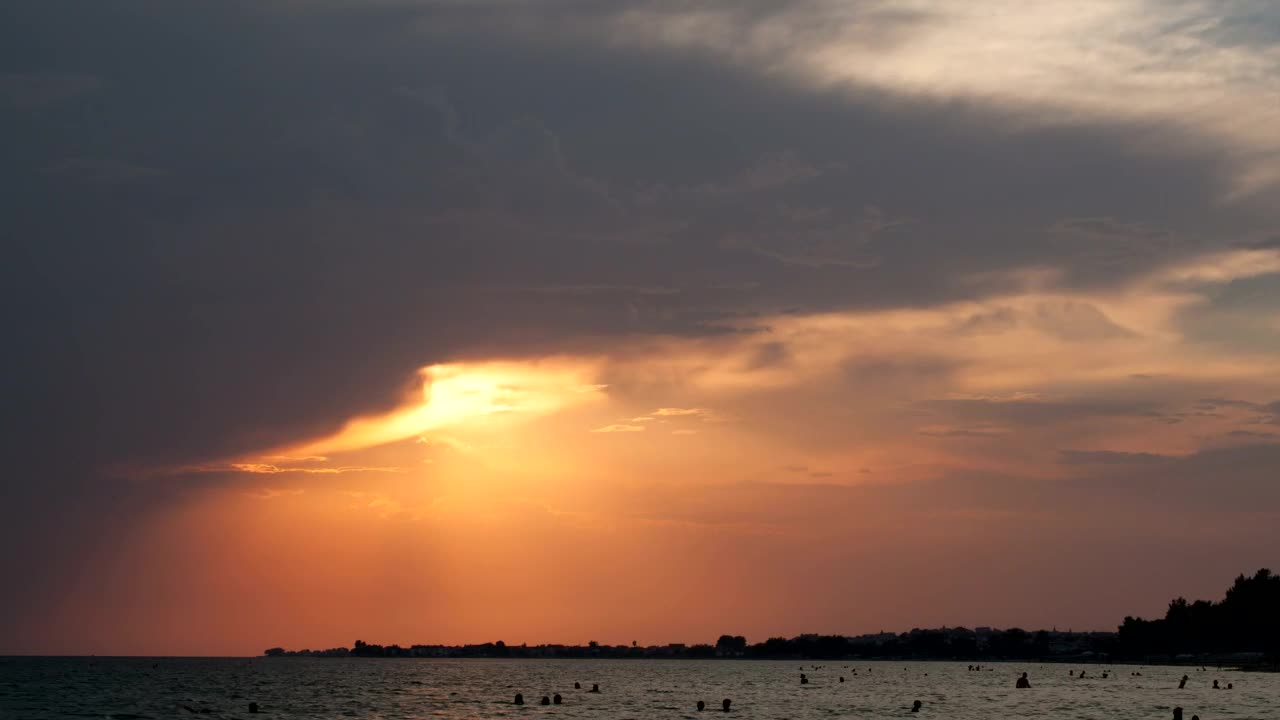 Free Video Stock sunset as people swim Live Wallpaper - Free Download