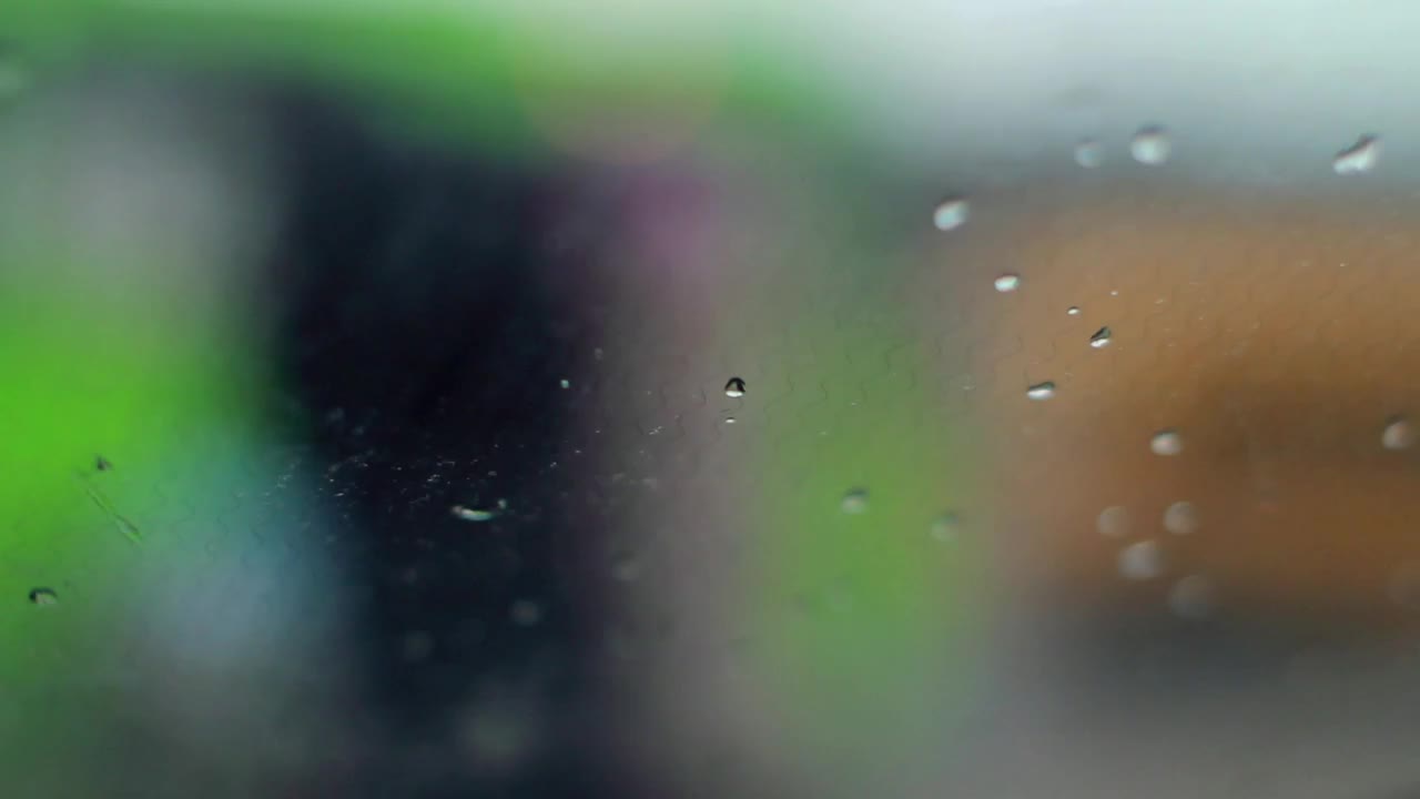 Free Video Stock traffic behind a rainy car window Live Wallpaper - Free Download
