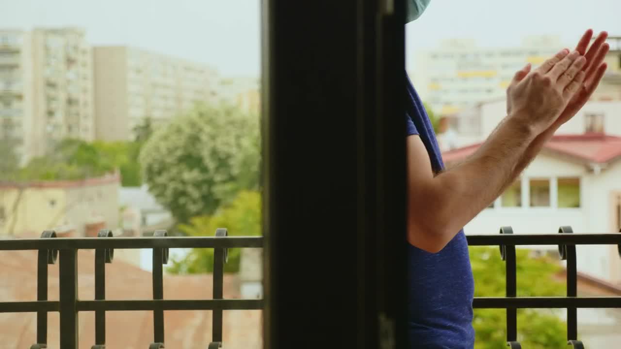 Stock Video Man Clapping While Wearing A Mask Animated Wallpaper - Free Download