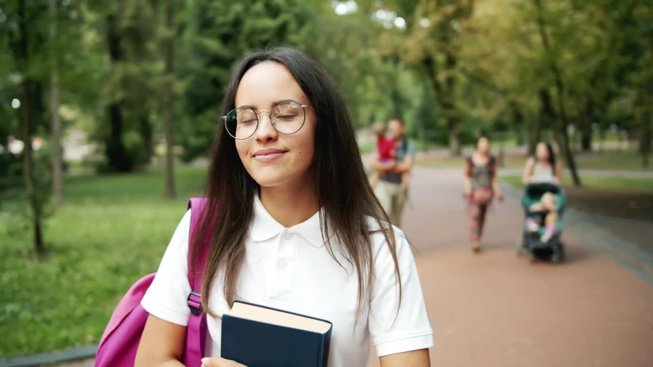Free Video Stock Smiling Student Inspired By Nature In Park Live Wallpaper - Free Download