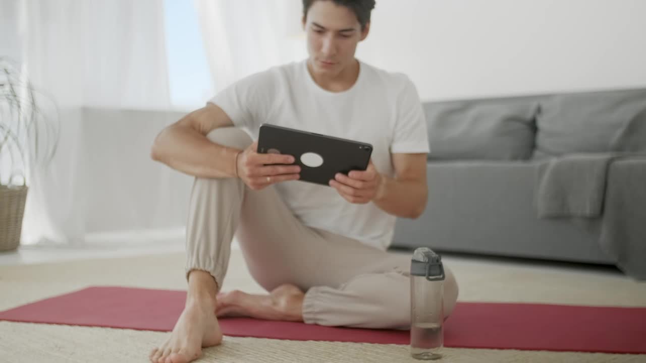 Free Stock Video Young Man Watching Yoga Videos For Practice Live Wallpaper - Free Download