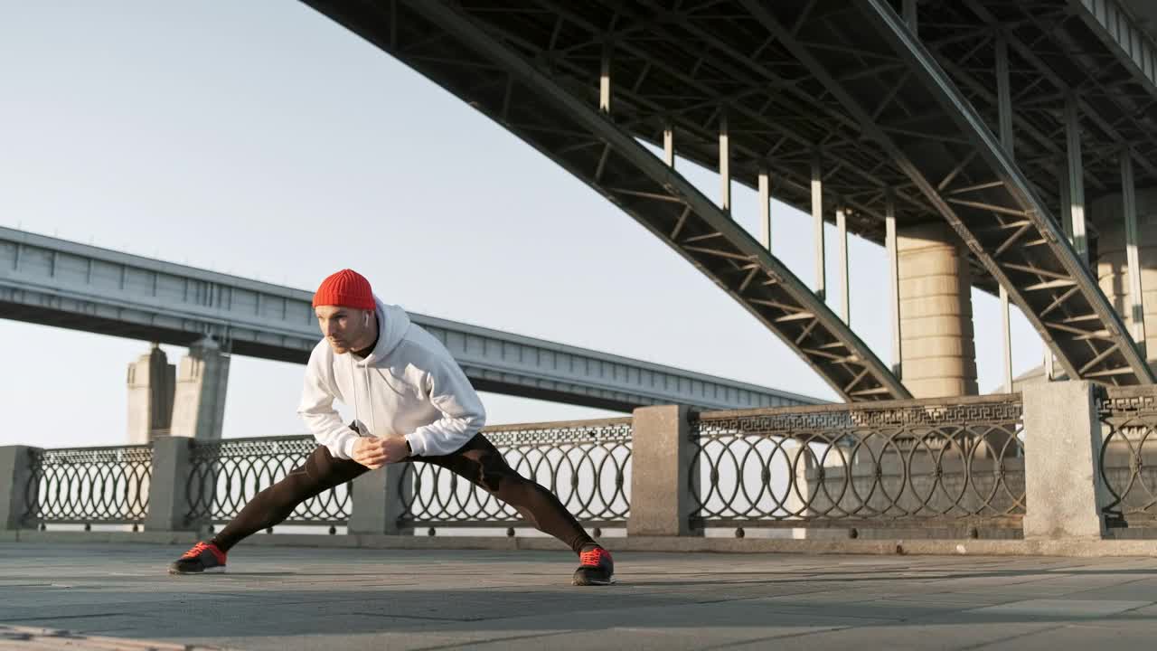 Stock Video Man Stretching His Body Before An Urban Workou Animated Wallpaper - Free Download