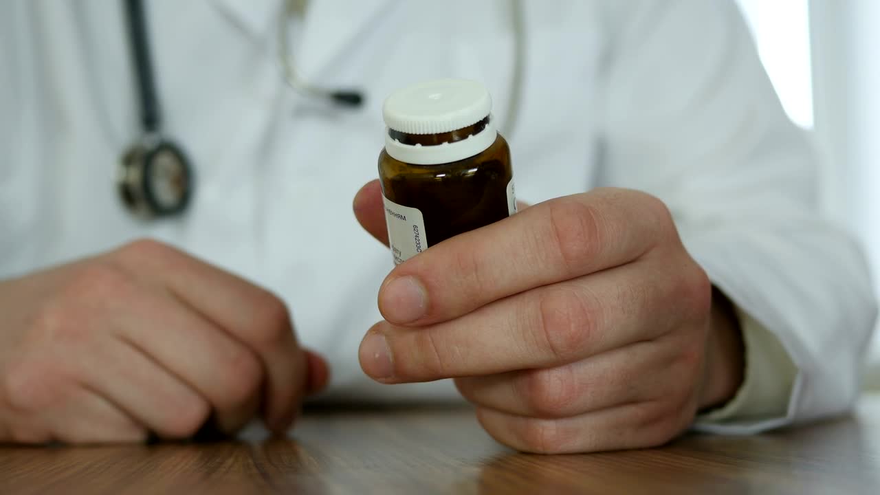 Stock Video Dcotor Opening A Bottle Of Pills Live Wallpaper For PC - Free Download