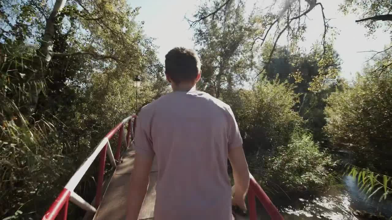 Stock Video Man Taking A Walk Through A Park In Morocc Animated Wallpaper - Free Download