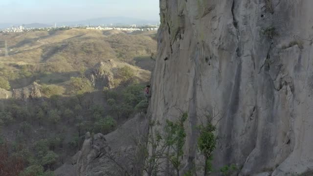 Free Stock Video Young Female Mountaineer Climbing A Large Rocky Mountain Smalllive Wallpaper - Free Download