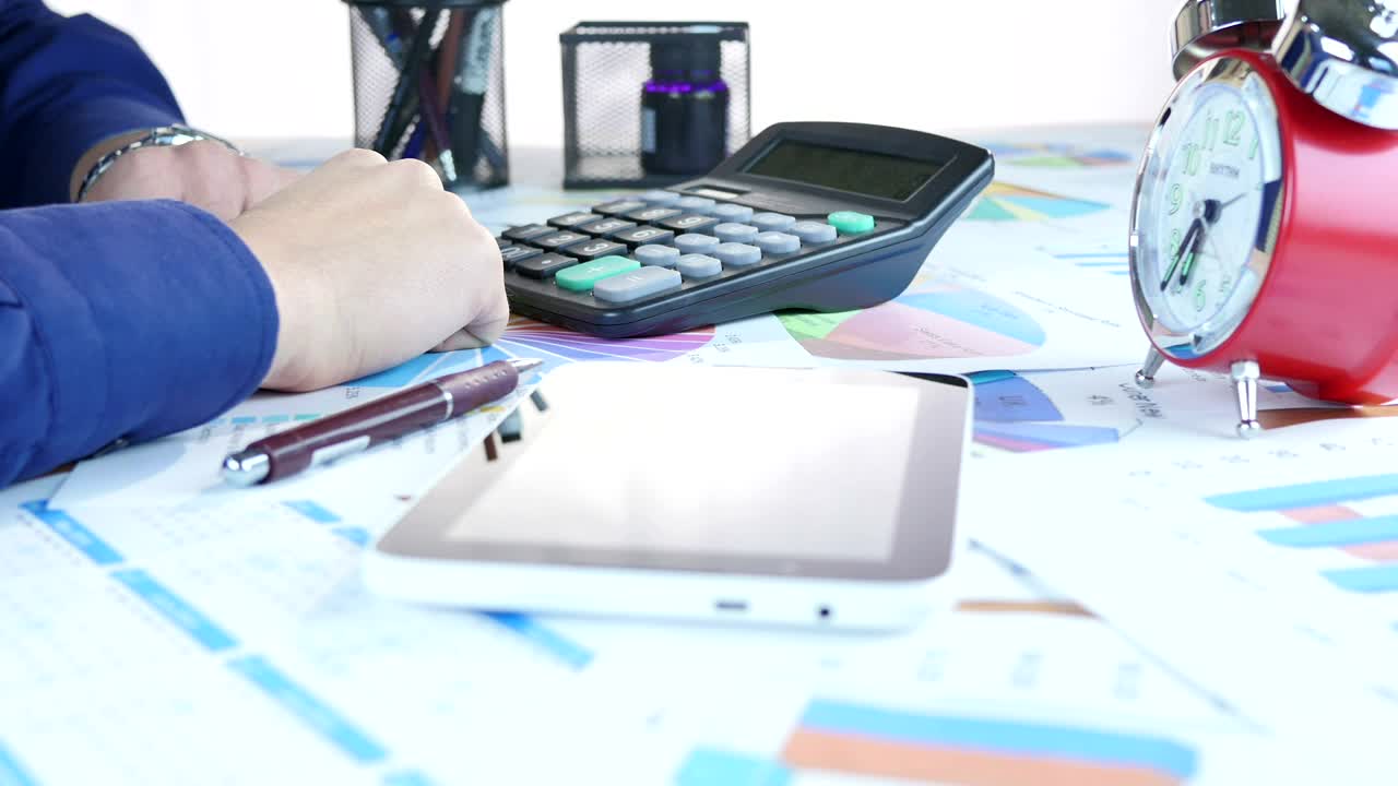 Stock Video Person Corroborating Data From Some Graphs On Paper Live Wallpaper - Free Download