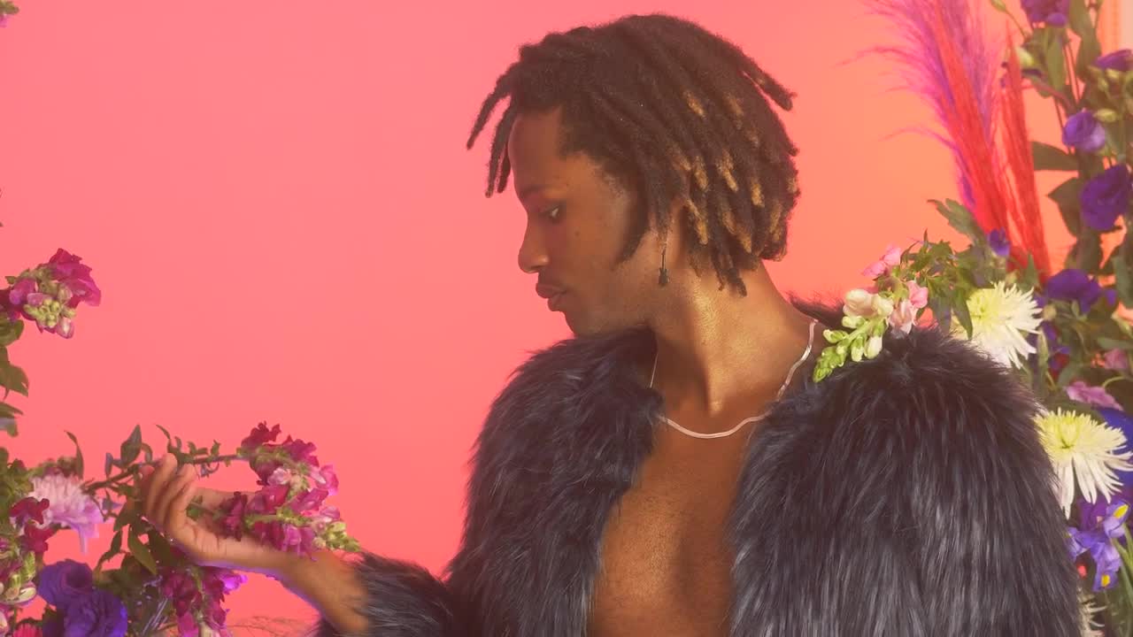 Stock Video Lgbtq Man Among Flowers While Appreciating Them Animated Wallpaper - Free Download
