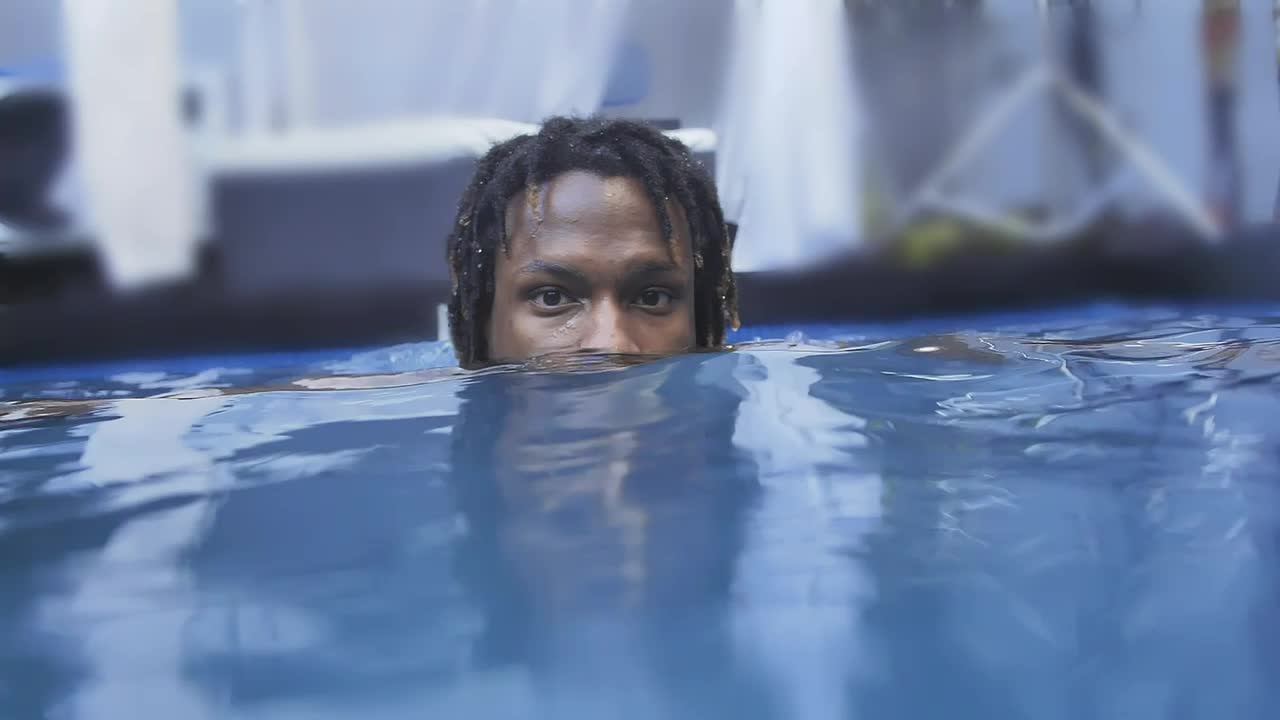 Stock Video Face Of A Man Leaning Out While He Floats On Live Wallpaper For PC - Free Download