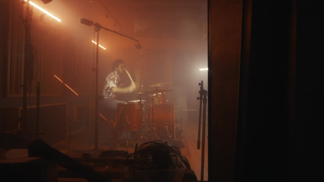 Stock Video Drummer Playing In A Studio Full Of Instruments Live Wallpaper For PC - Free Download