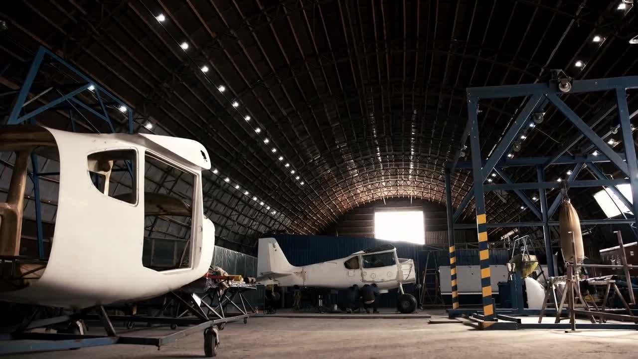 Stock Video Man Walking In An Aircraft Hanga Animated Wallpaper - Free Download