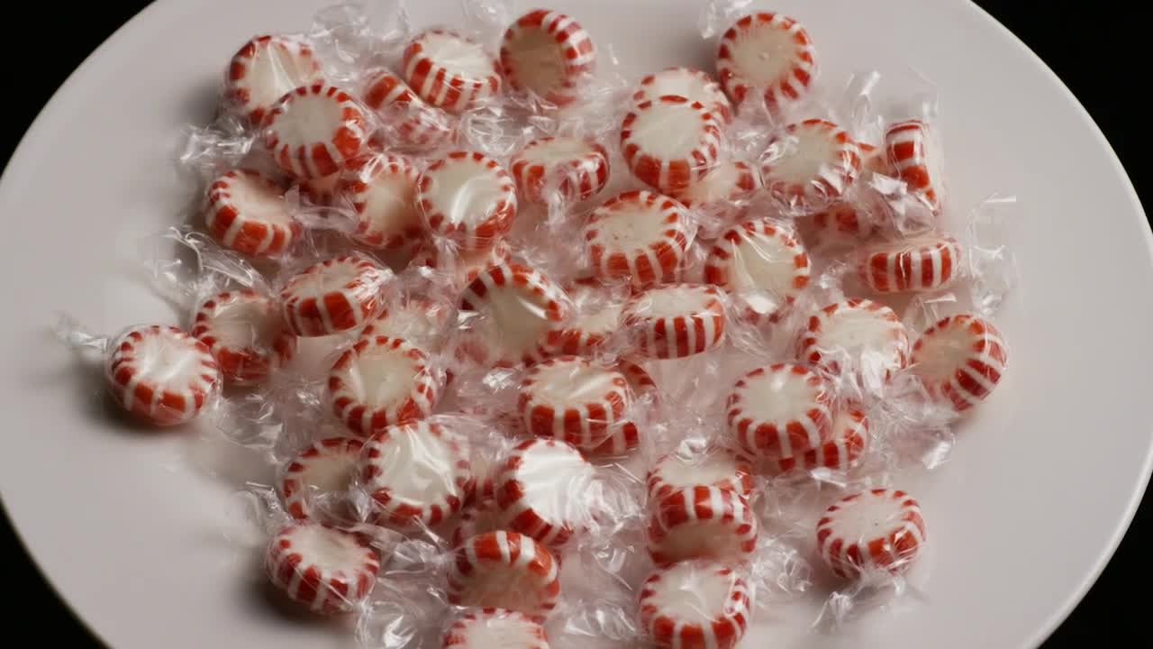 Video Stock Red Candy Wrapped In A Spinning Bowl Live Wallpaper Free - Free Download