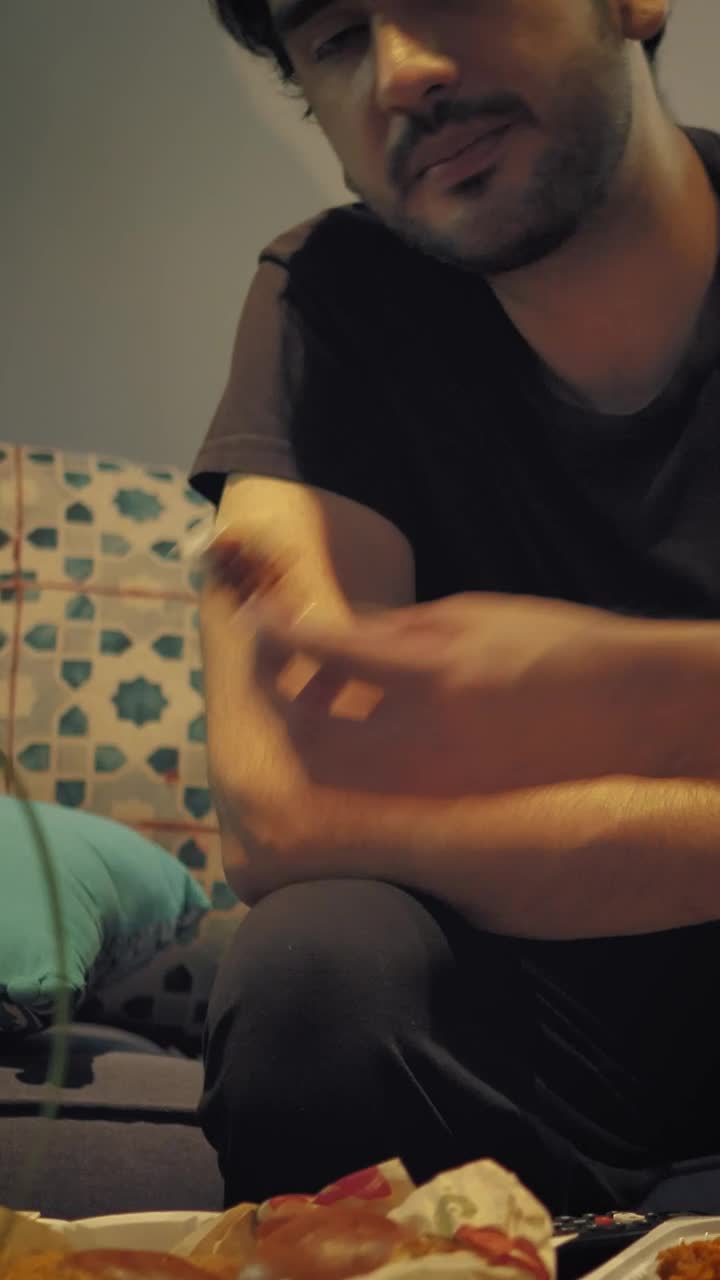 Stock Video Man Watching Tv While Eating Nuggets With Dressin Animated Wallpaper - Free Download