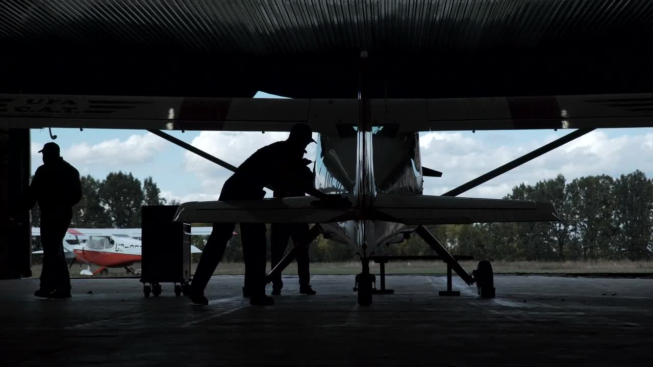 Free Stock Video Silhouette Of A Man Polishing A Biplane Live Wallpaper - Free Download