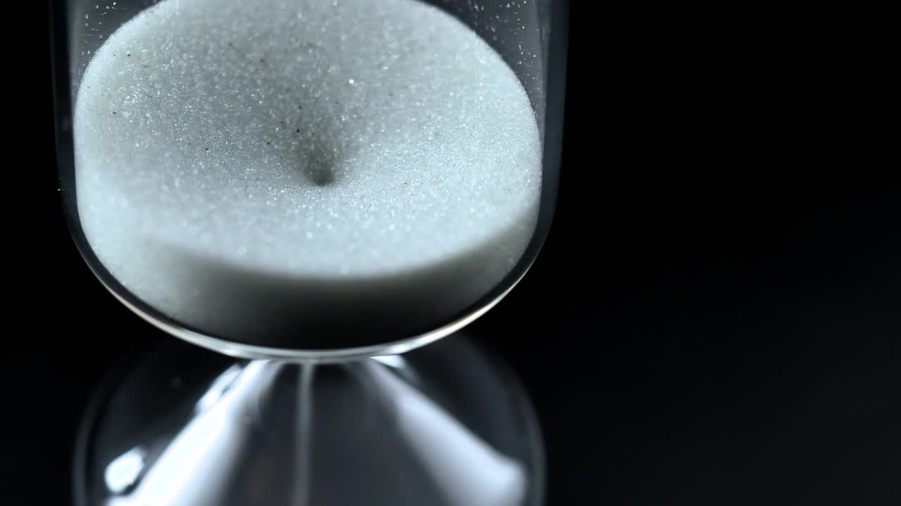Stock Video Hourglass Close Up On A Black Background Seen From Above Animated Wallpaper - Free Download