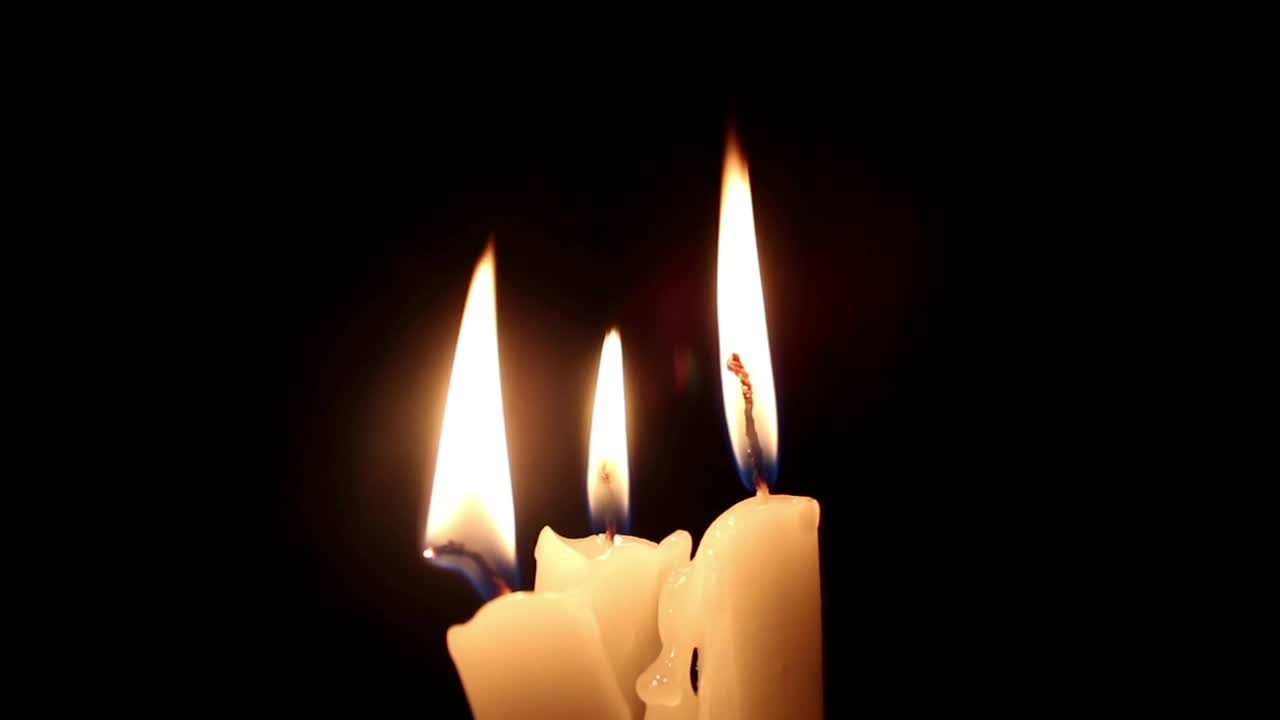 Free Video Stock three candles lit in the dark together Live Wallpaper - Free Download