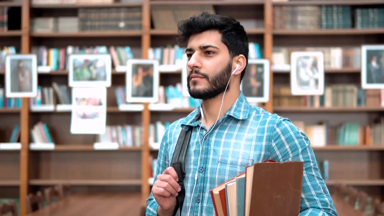 Stock Video Handsome Smiling University Student With Books Animated Wallpaper - Free Download