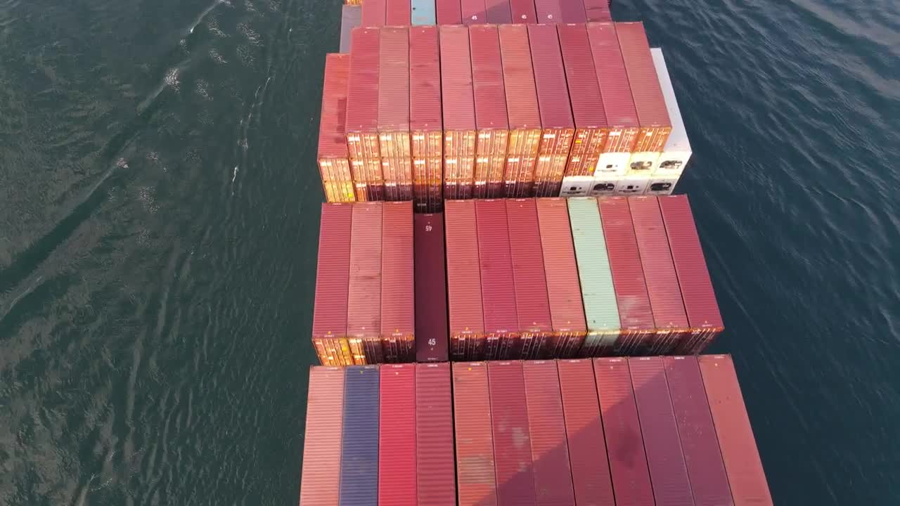 Stock Video Flying Over A Cargo Ship Leaving A Port Live Wallpaper For PC - Free Download