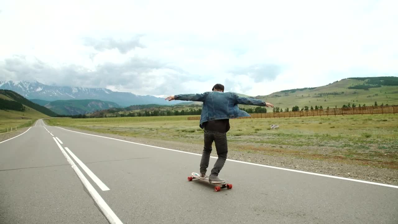 Stock Video Hipster Man On A Longboard On The Road Animated Wallpaper - Free Download