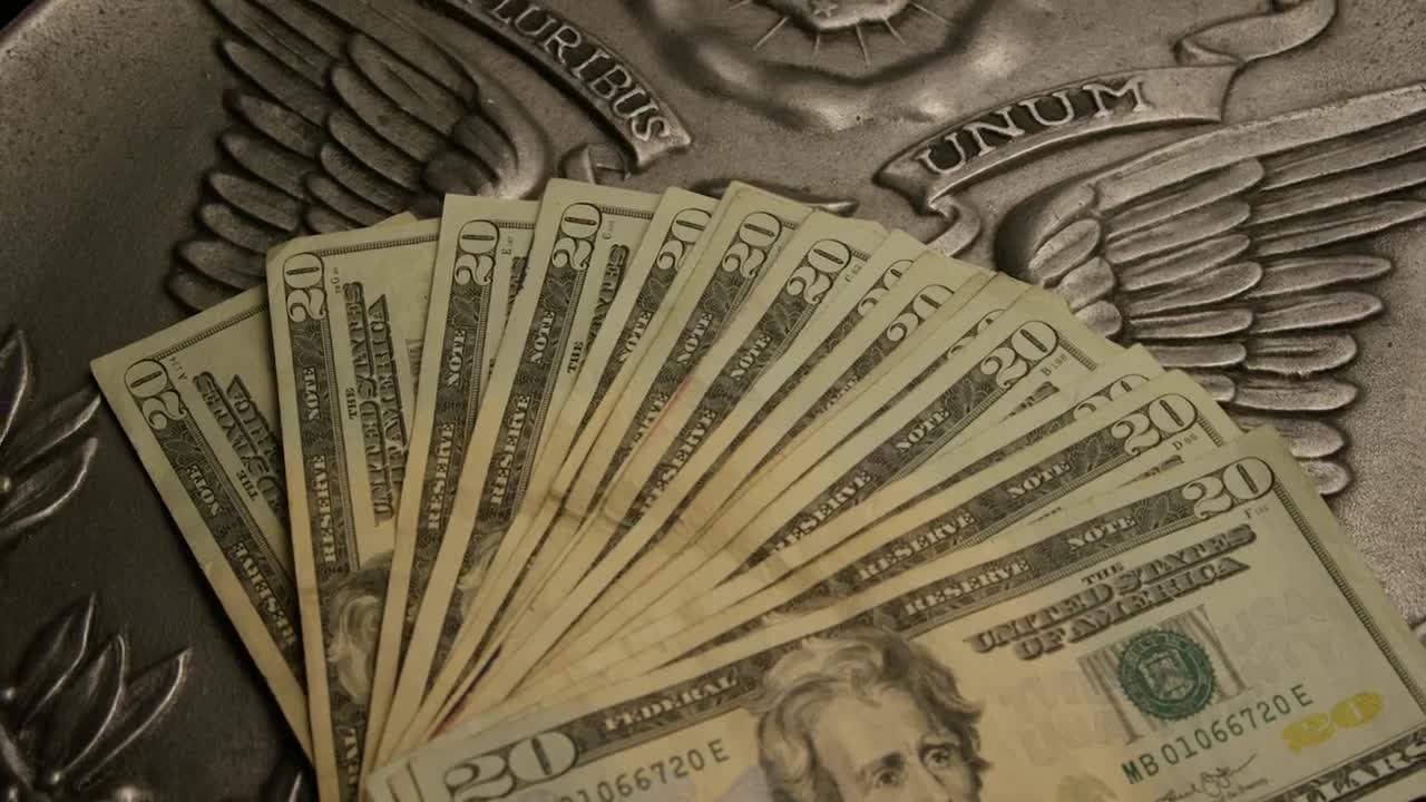 Free Video Stock Stack Of Dollar Bills Of  Over A Country Emblem Live Wallpaper - Free Download