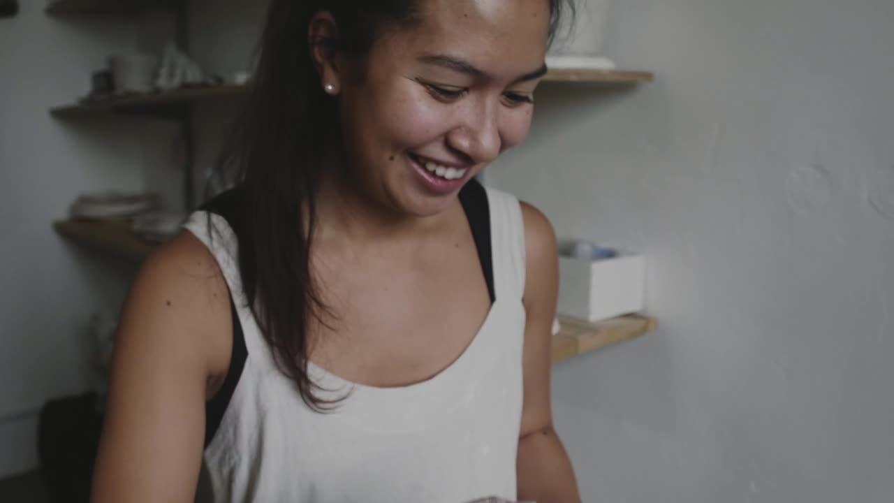 Free Video Stock Smiling Woman With Pottery Object Live Wallpaper - Free Download