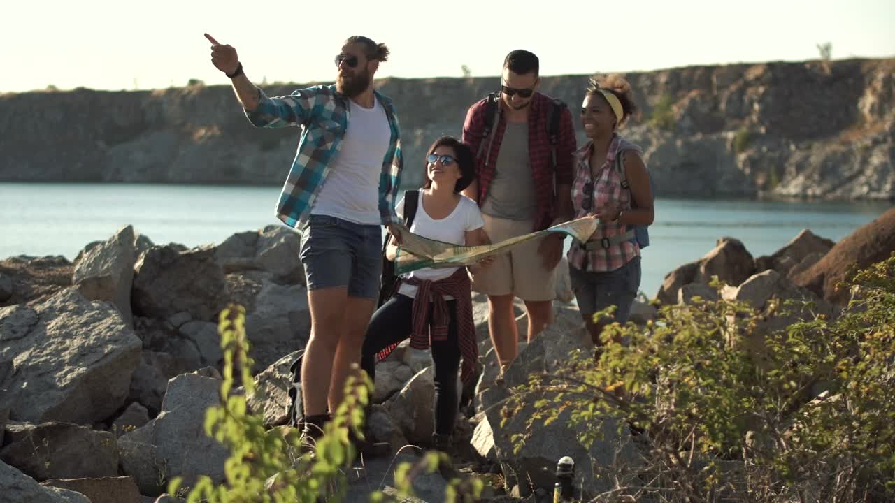 Stock Video Lost Tourists Searching The Map Near The Lake Animated Wallpaper - Free Download