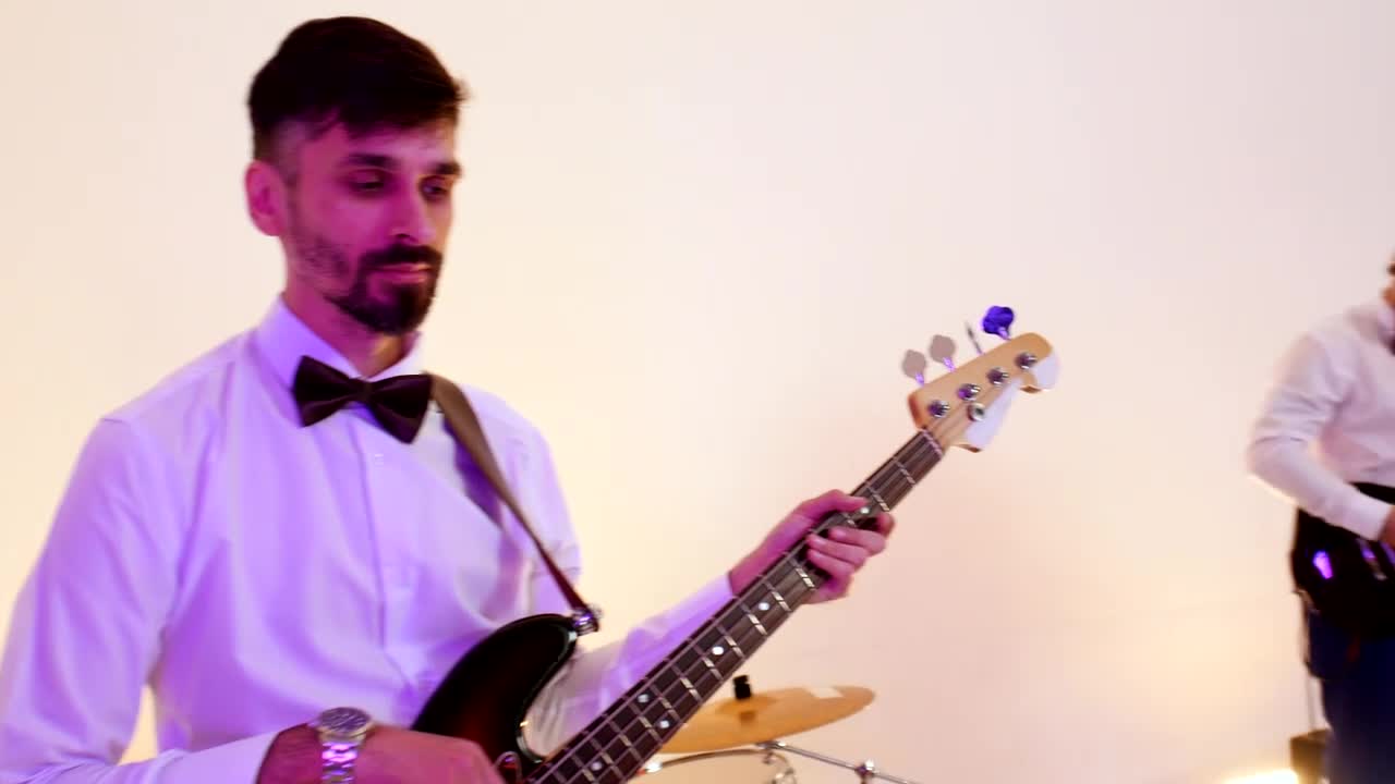 Stock Video Musical Band Performing A Song In A Bright Studio Live Wallpaper - Free Download
