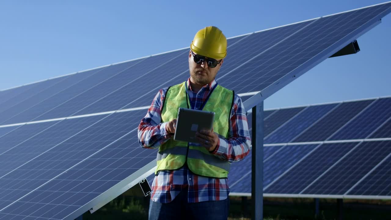 Stock Video Engineer With A Tablet In The Solar Panels Field Live Wallpaper For PC - Free Download