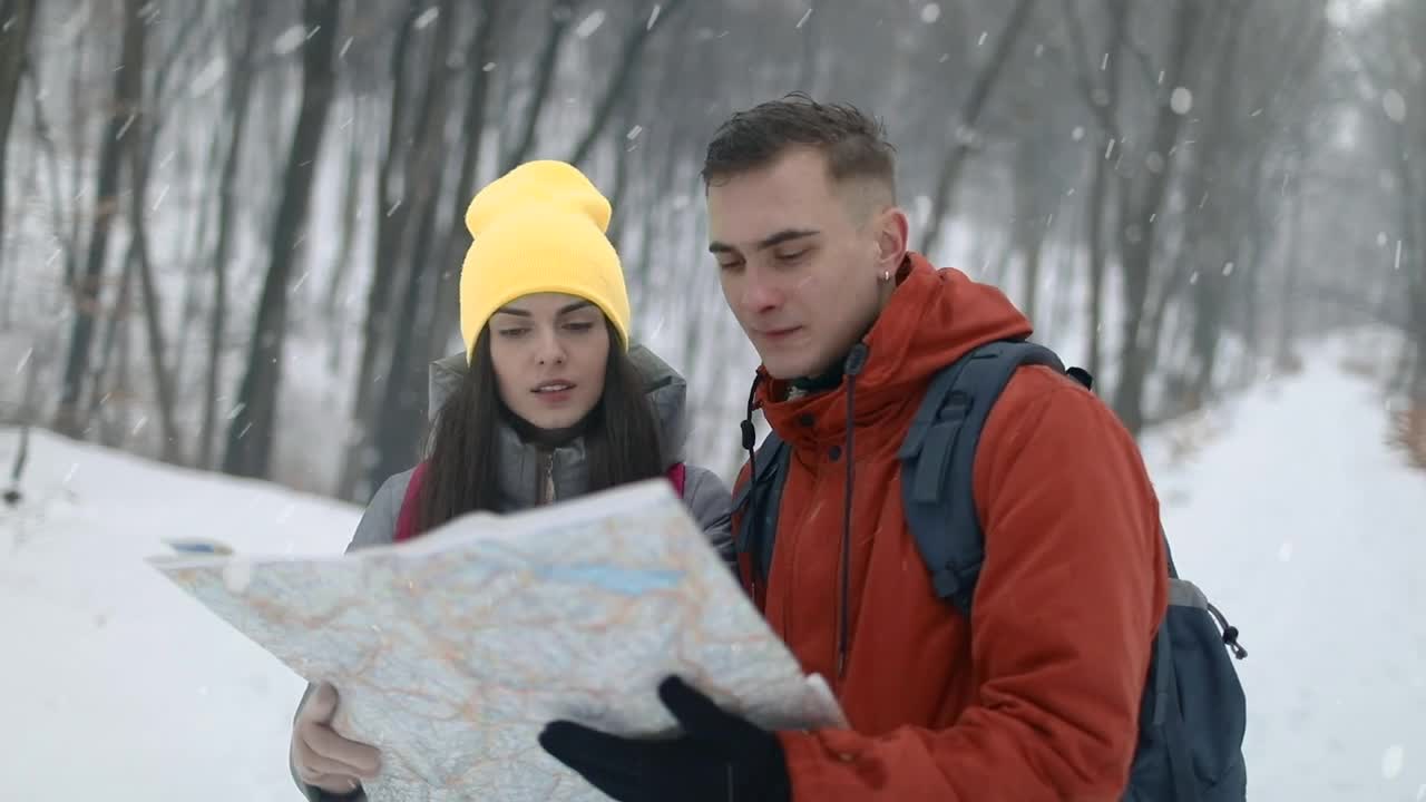 Stock Video Couple Checking Map On Hike In Snowfall Live Wallpaper For PC - Free Download