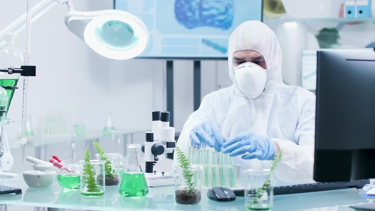 Stock Video Man Checking Organic Samples Animated Wallpaper - Free Download