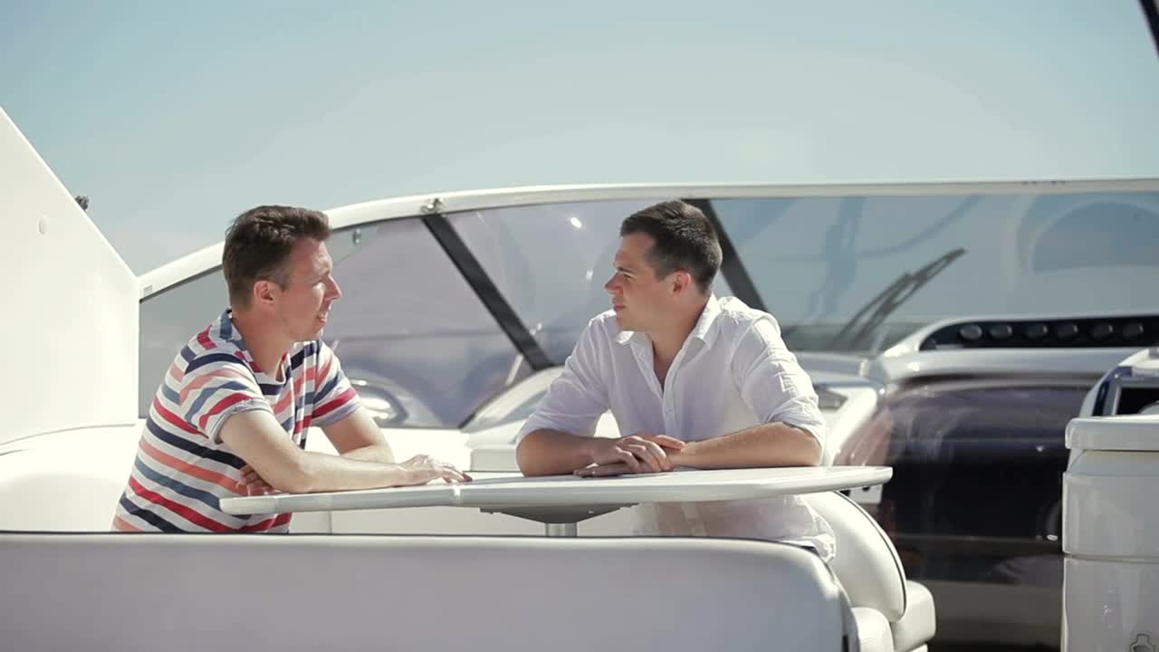 Stock Video Men Discuss Business Sale On Deck Of Yach Animated Wallpaper - Free Download