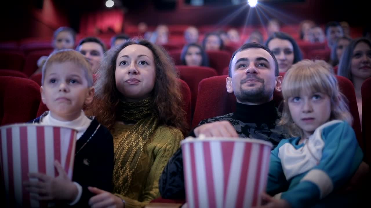 Stock Video Family Watching A Childrens Movie At The Cinema Live Wallpaper For PC - Free Download